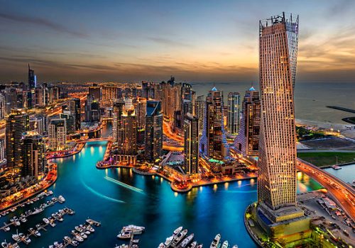 Dubai Marina from a high view showing the boats, sea, and the city scape.